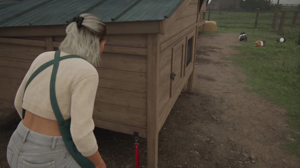 A third-person view over the shoulder of a woman with bleached-blond hair in a black claw clip, cream cropped sweater and green apron, standing beside a wooden rabbit hutch. A red lanyard hangs below the hutch, and three black-and-white and brown-and-white rabbits sit on the grass in the distance.